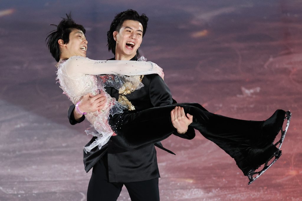 Liu Xinyu of Team China carrying Yuzuru Hanyu of Team Japan skates after the Figure Skating Gala Exhibition on day 16 of the 2022 Winter Olympics at Capital Indoor Stadium on Feb. 20, 2022, in Beijing, China.