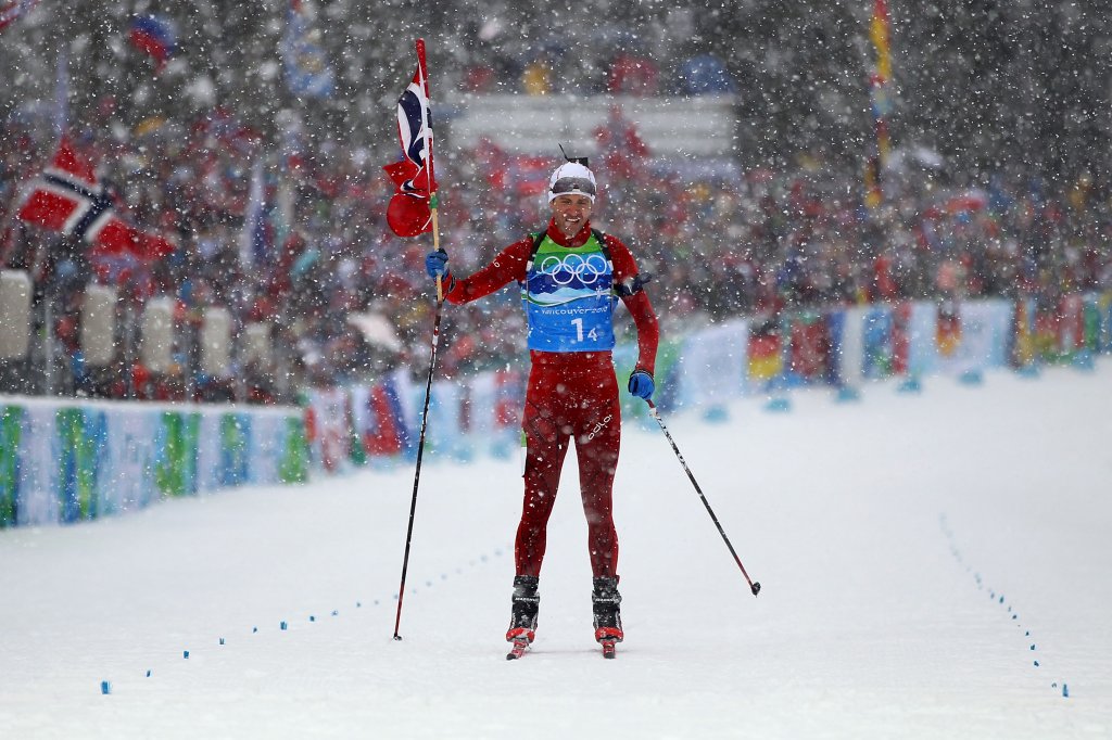 Ole Einar Bjoerndalen of Norway crosses the finish line to win the gold medal in the men's 4 x 7.5 km biathlon relay