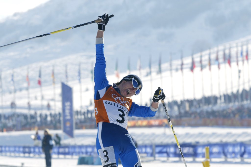 Stefania Belmondo of Italy celebrates winning the gold medal in the women's 15km cross country