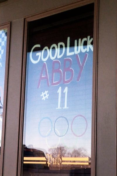 Store window painted to say "Good Luck Abby #11"