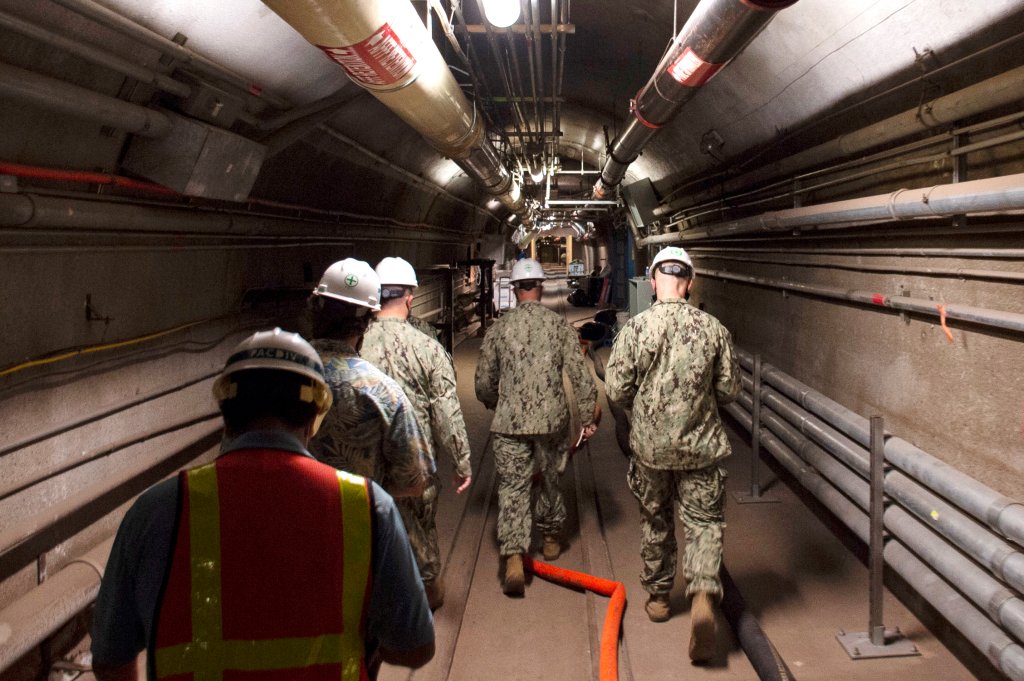 John Korka, Commander, Naval Facilities Engineering Systems Command (NAVFAC), and Chief of Civil Engineers, leads Navy and civilian water quality recovery experts through the tunnels of the Red Hill Bulk Fuel Storage Facility, near Pearl Harbor