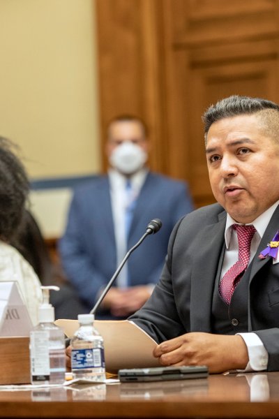 Zeneta Everhart, whose son Zaire Goodman, 20, was shot in the neck during the Buffalo Tops supermarket mass shooting and survived, listens as Roy Guerrero, a pediatrician from Uvalde, Texas, testifies during a House Committee on Oversight and Reform hearing on gun violence on Capitol Hill in Washington, Wednesday, June 8, 2022.