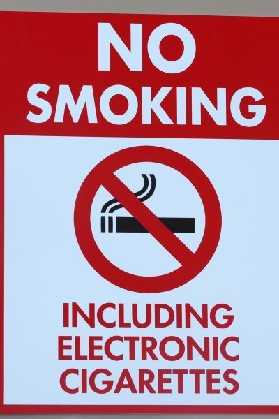 A sign reads "No Smoking Including Electronic Cigarettes" is displayed on a wall in Las Vegas, Nevada.