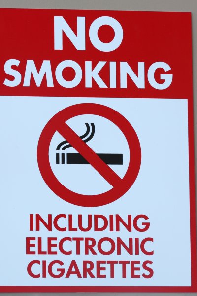 A sign reads "No Smoking Including Electronic Cigarettes" is displayed on a wall in Las Vegas, Nevada.