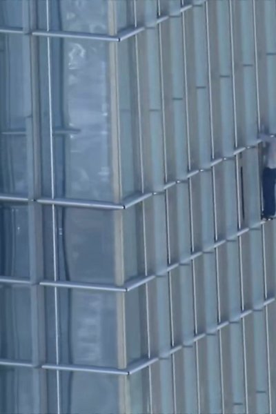 Aerial photo of man climbing side of Devon Tower in Oklahoma City