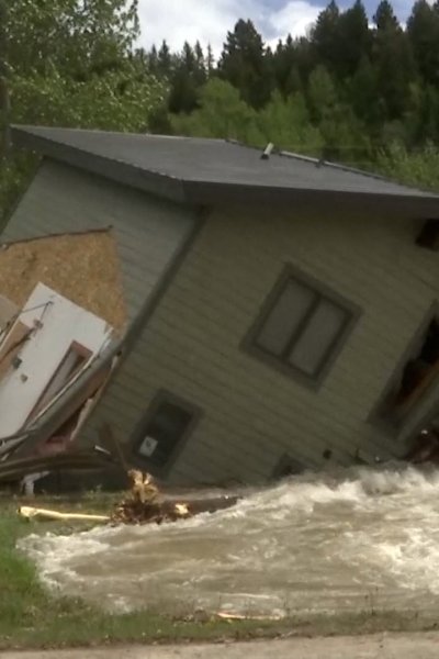 House in Yellowstone National Park submerged in floodwaters.