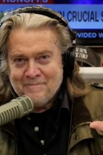 Steve Bannon speaks on a recorded media appearance with CNN in the background.