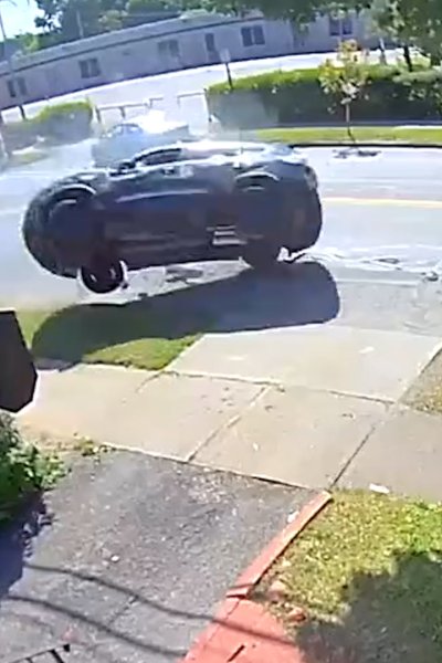 Doorbell image of car mid air after crash.