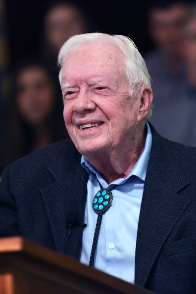 Former U.S. President Jimmy Carter waves to the congregation after teaching Sunday school at Maranatha Baptist Church in his hometown of Plains, Georgia on April 28, 2019. Carter, 94, has taught Sunday school at the church on a regular basis since leaving the White House in 1981, drawing hundreds of visitors who arrive hours before the 10:00 am lesson in order to get a seat and have a photograph taken with the former President and former First Lady Rosalynn Carter.