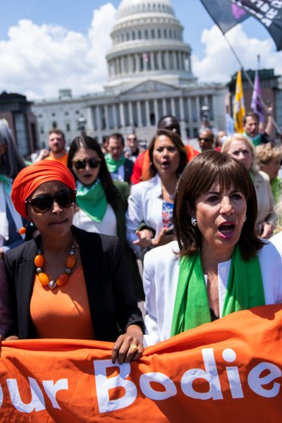First row from left, Reps. Nydia Velázquez, D-N.Y., Ilhan Omar, D-Minn., Jackie Speier, D-Calif., and Carolyn Maloney, D-N.Y., make their way to the Supreme Court for a sit-it in to protest the decision to overturn Roe v. Wade