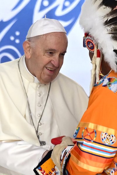 Pope Francis (L) speaks to members of the Indigenous community at Muskwa Park in Maskwacis, Alberta, Canada, on July 25, 2022.