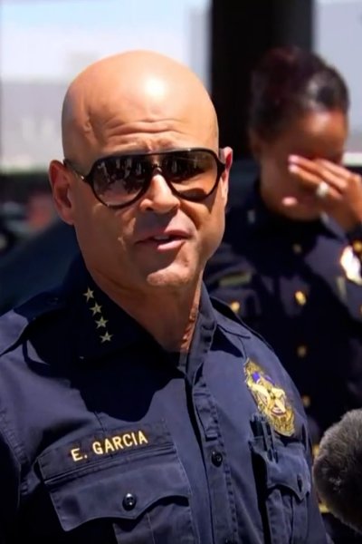 Dallas Police Chief Eddie Garcia speaks outside of the Dallas Love Field airport.