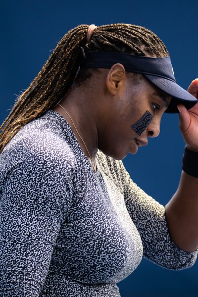 Serena Williams touches her hat