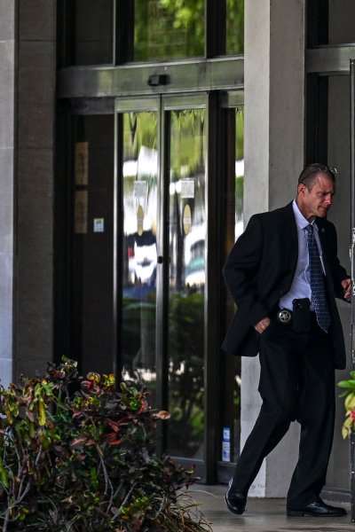 Security officers guard the entrance to the Paul G. Rogers Federal Building & Courthouse as the court holds a hearing to determine if the affidavit used by the FBI as justification for last week's search of Trump's Mar-a-Lago estate should be unsealed, at the US District Courthouse for the Southern District of Florida in West Palm Beach, Florida.