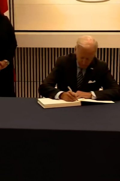 Joe Biden SIgns condolence book at UK Embassy