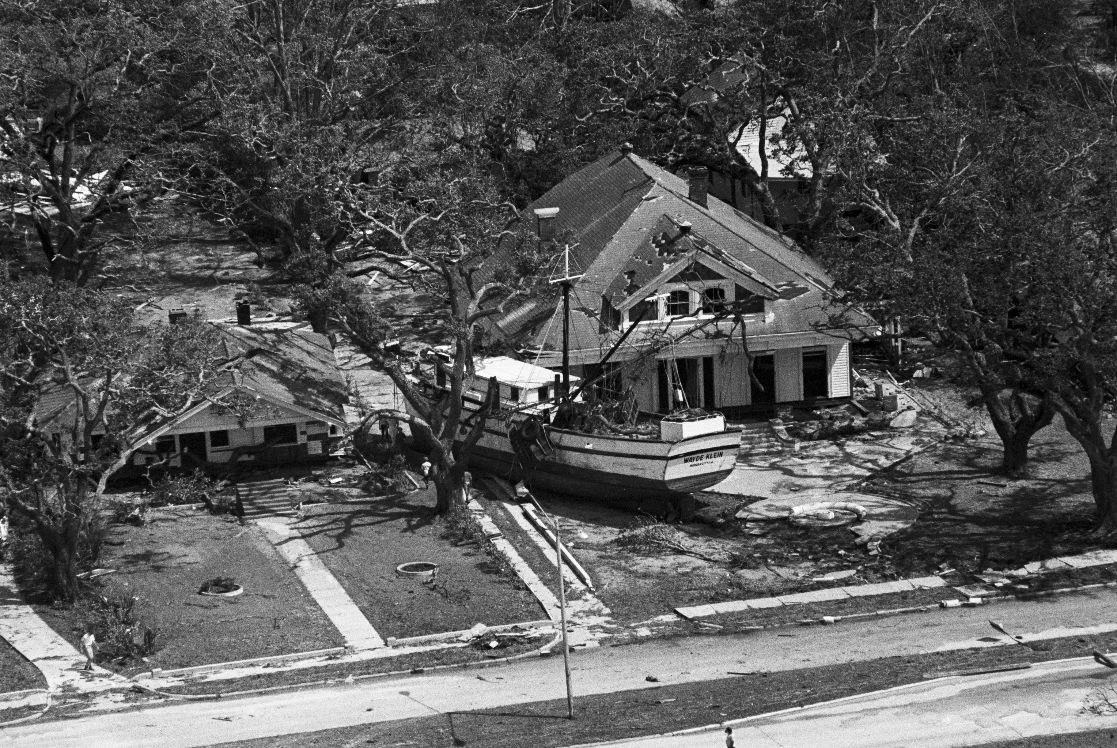 The shrimper "Wade Klein" is thrown against a house facing the beach in Biloxi, Mississippi, Aug. 18, 1969, shortly after Hurricane Camille tore through the Mississippi Gulf Coast.