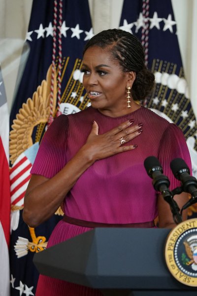 Former US First Lady Michelle Obama speaks during an event to unveil her and former President Barack Obama's official White House portraits, in the East Room of the White House in Washington, DC.