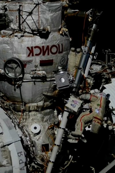Two cosmonauts float outside of ISS