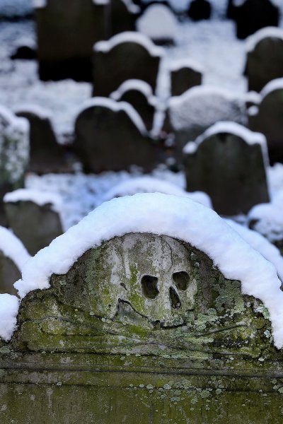 Snow covers the tops of the old gravestones on Halloween morning in the historic Granary Burying Ground in Boston, where some of America's most notable citizens are buried, on Oct. 31, 2020.