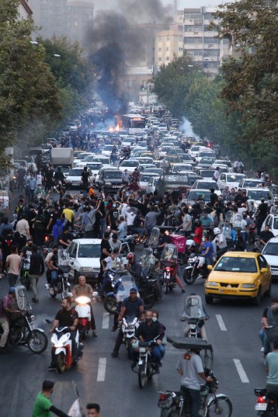 Iranian demonstrators taking to the streets of the capital Tehran