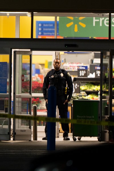 Law enforcement work at the scene of a mass shooting at a Walmart, Wednesday, Nov. 23, 2022, in Chesapeake, Va.
